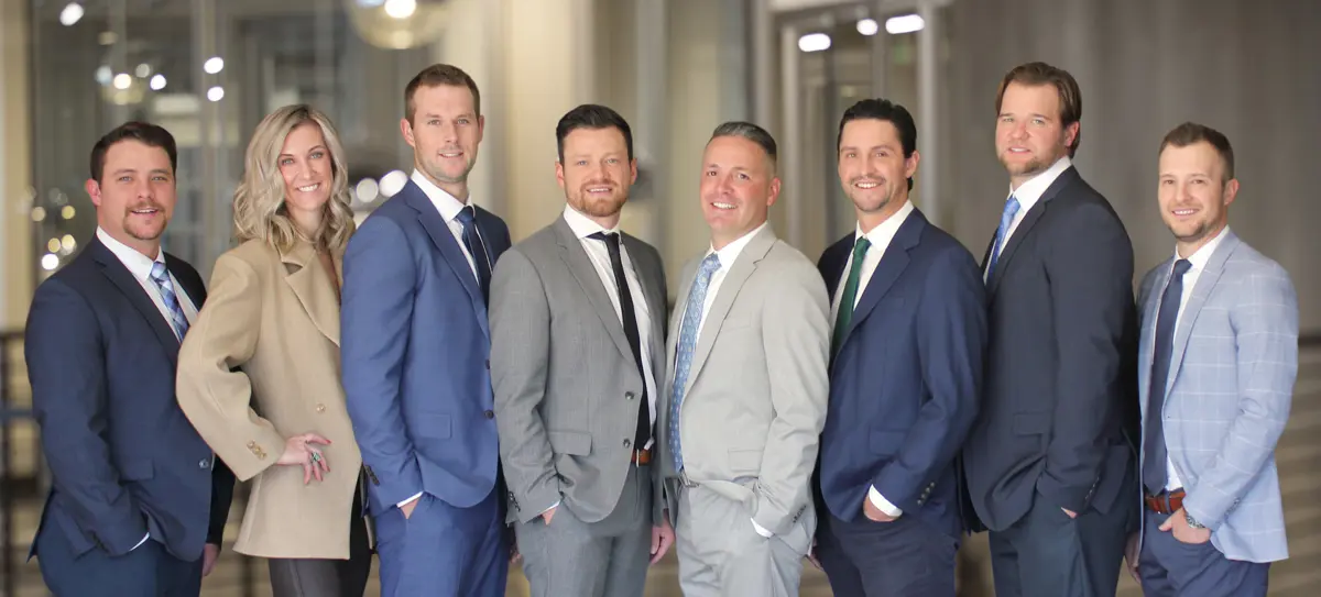 Portrait of the Knowlton Lawson Team in business professional clothing.